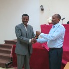 Menale handing over the project vehicle keys to EIAR's Dr Wolde at the EIAR offices in Addis Ababa