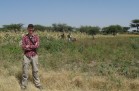 Adrian Young standing in field site Ethiopia