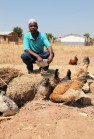 Farmer cultivating termites to provide extra protein for his chickens, Singida, Tanzania. (Photo: S Ingleton 360º)