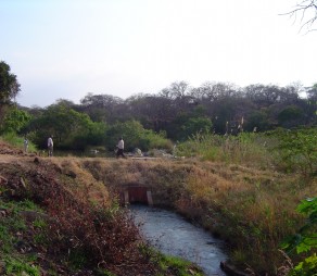 Project staff inspecting irrigation canal headworks in the Great Ruaha region of Tanzania. Photo credit J Pittock, ANU