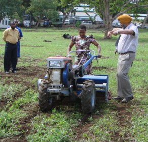 Project partners demonstrating two-wheeled tractors at project launch. Photo: CIMMYT